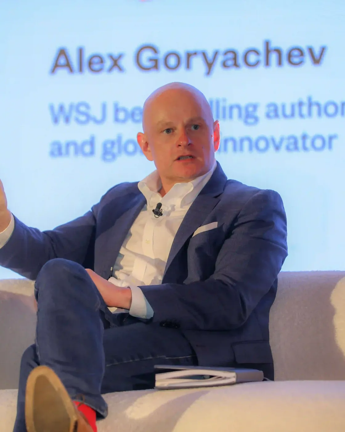 Alex Goryachev delivering an AI keynote to a live corporate audience